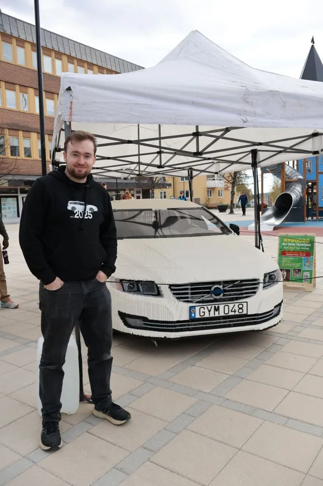 David Gustafsson posing with his 1:1 scale LEGO Volvo V70 MOC David Gustafsson posing with his 1:1 scale LEGO Volvo V70 MOC