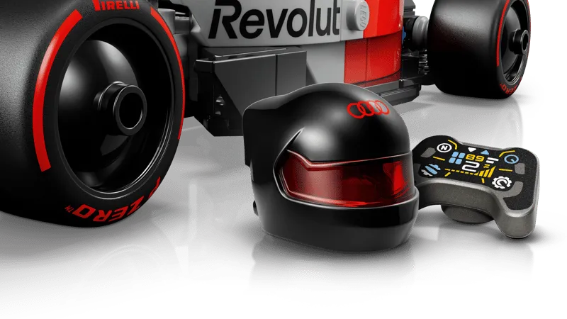 Close-up of the LEGO Audi Revolut F1 Team R26 Race Car 77259's black driver helmet with a red visor and a detailed pit board accessory.