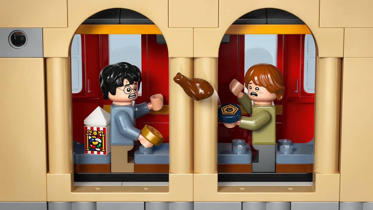 Harry and Ron inside the train carriage.