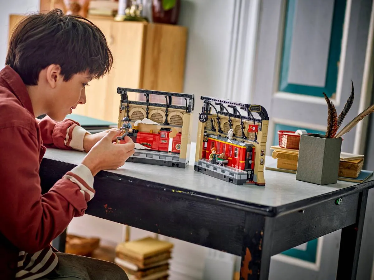 Person assembling the two halves of the Book Nook.
