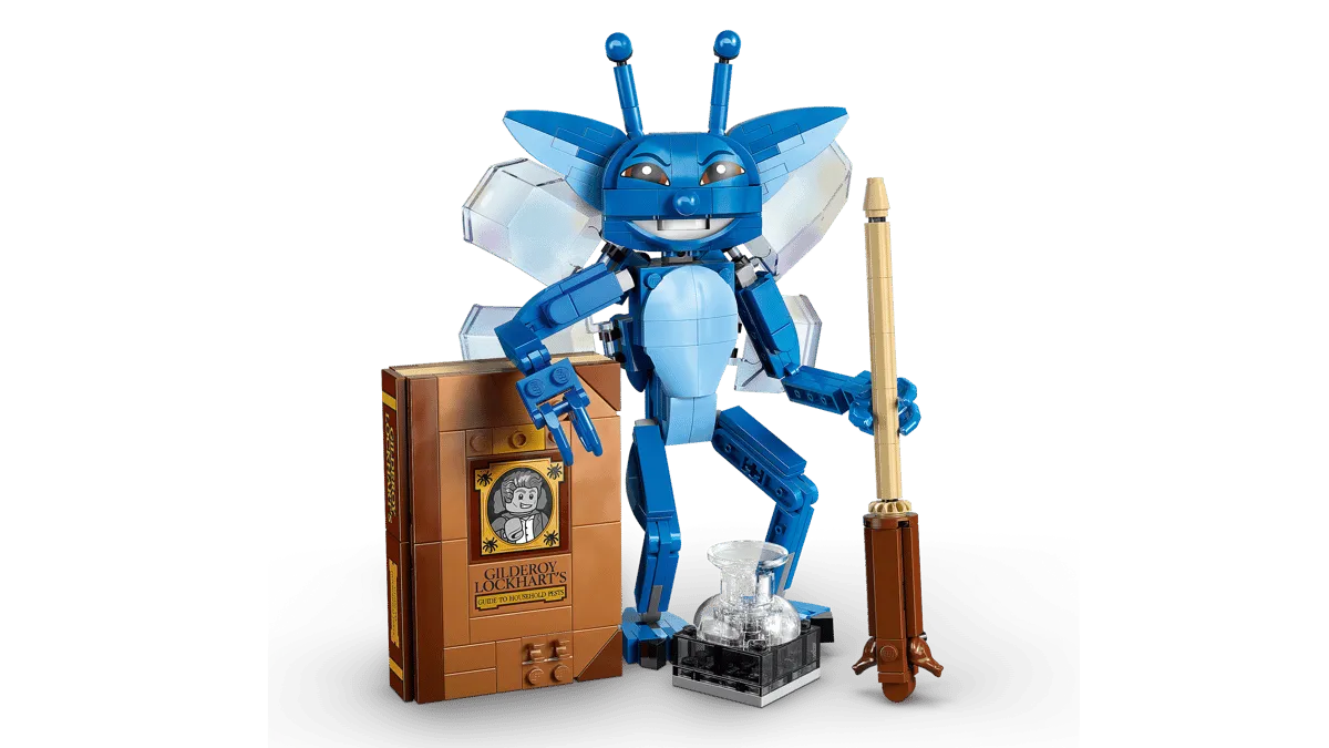 Pixie standing, holding quill.