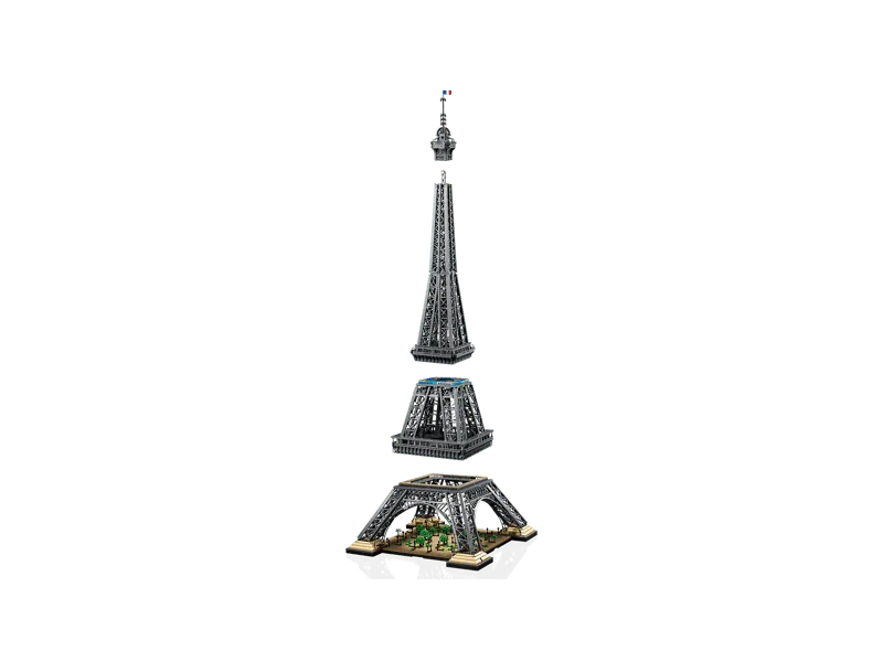 Exploded view of the LEGO Eiffel Tower 10307 model, showing its four main modular sections detached from each other: base, lower section, middle section, and spire.
