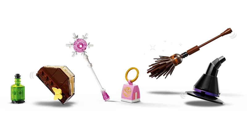 Close-up of all individual Lego accessories from the Elphaba & Glinda Figures set laid out: a potion bottle, spellbook, wand, handbag, broom, and witch's hat.