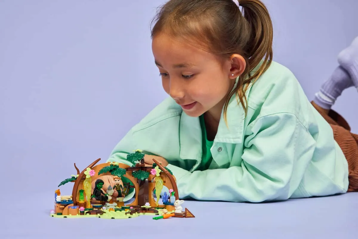 Child playing with set.