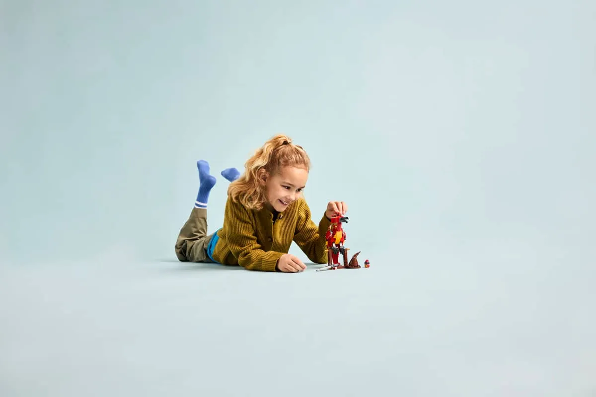 Child playing with the Fawkes LEGO set.