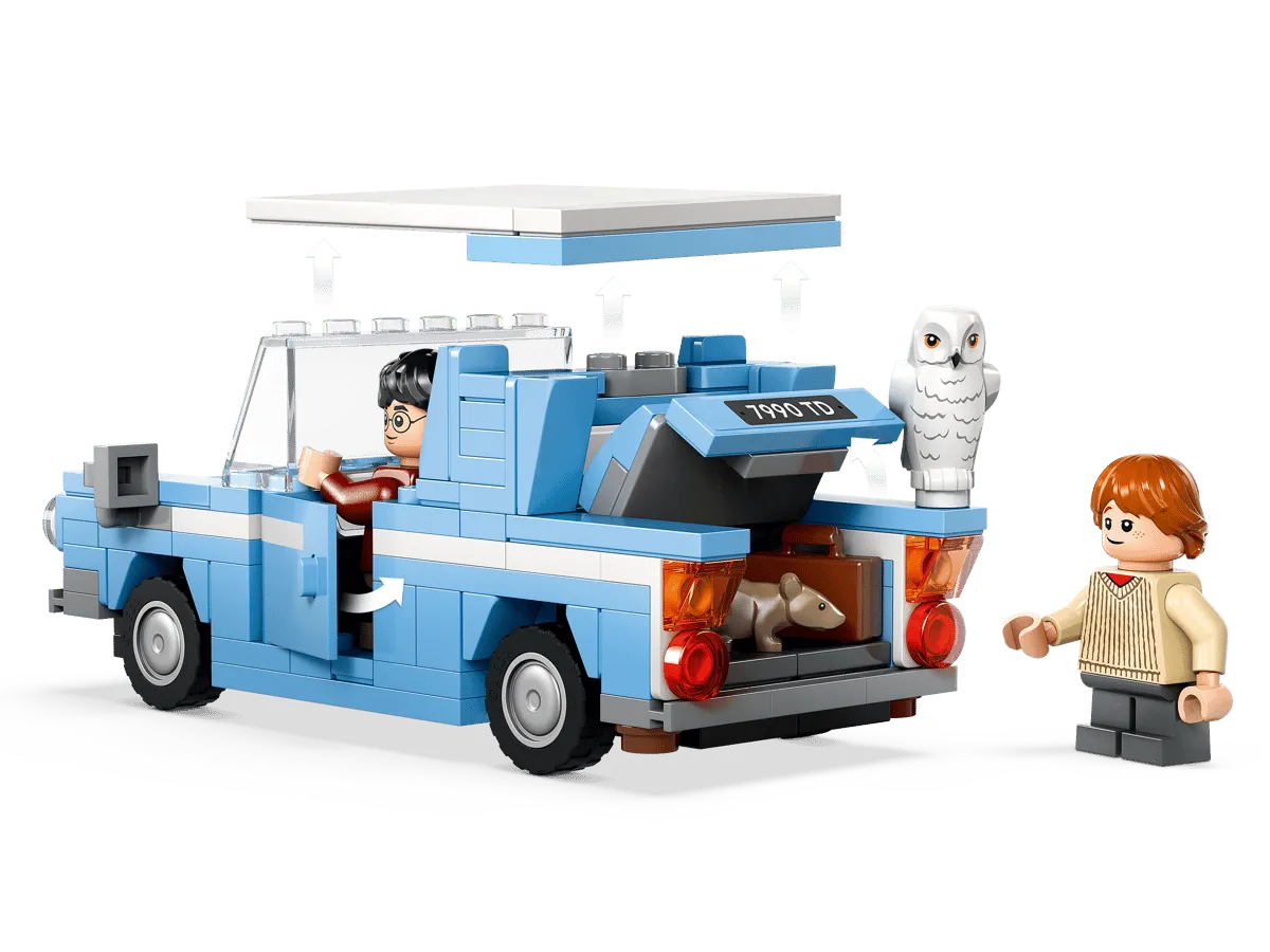 Ford Anglia with open roof and trunk.