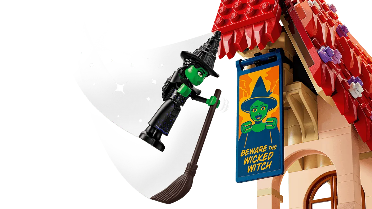 Elphaba flying past banner.