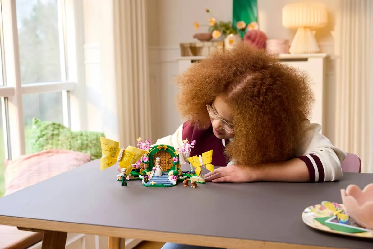 Person playing with set on table.