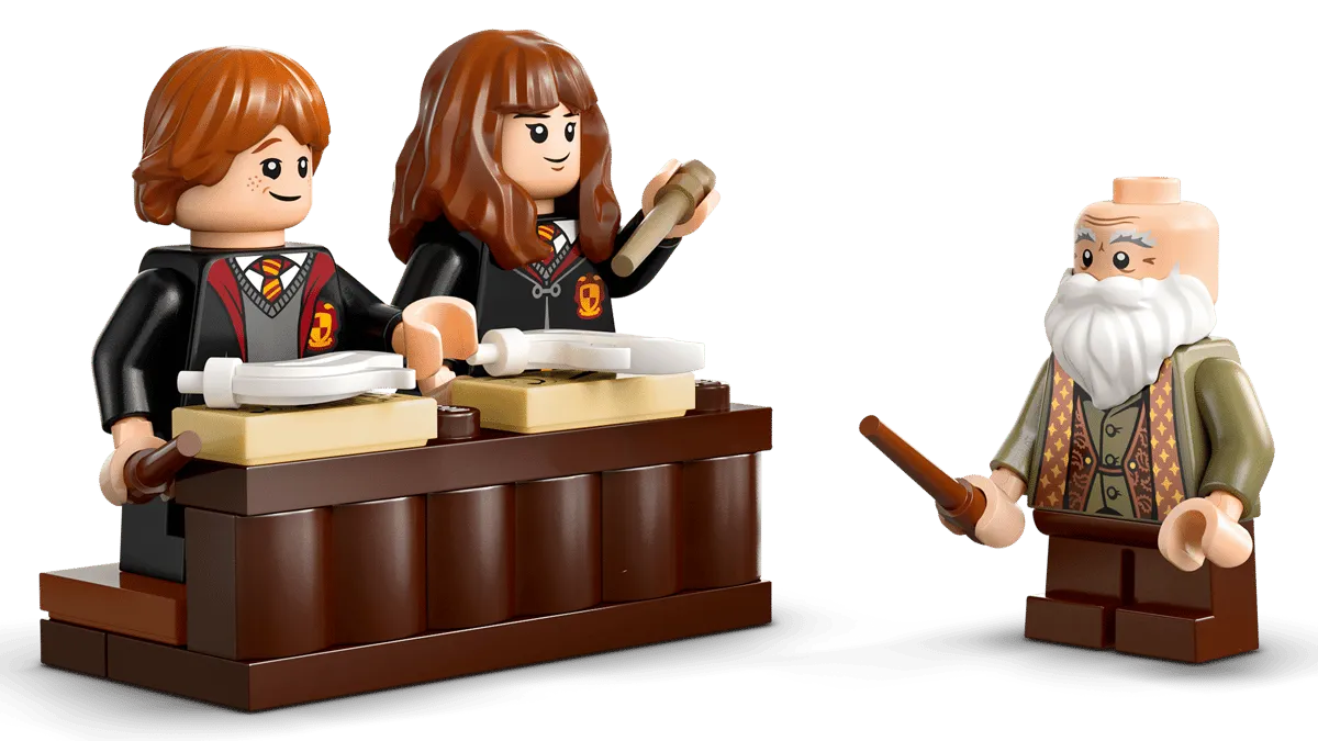 Close-up of Ron, Hermione, and Professor Flitwick minifigures.