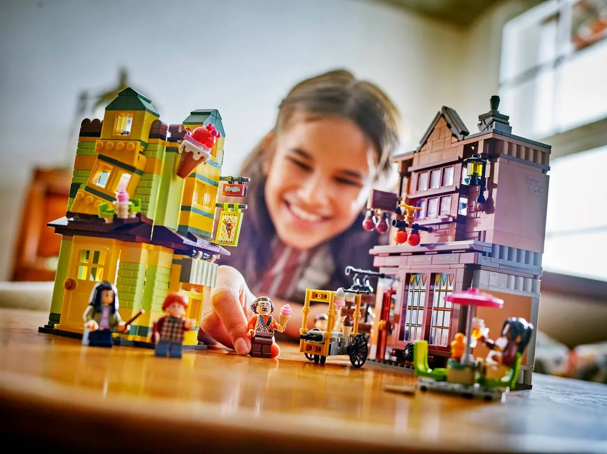 Child playing with set.