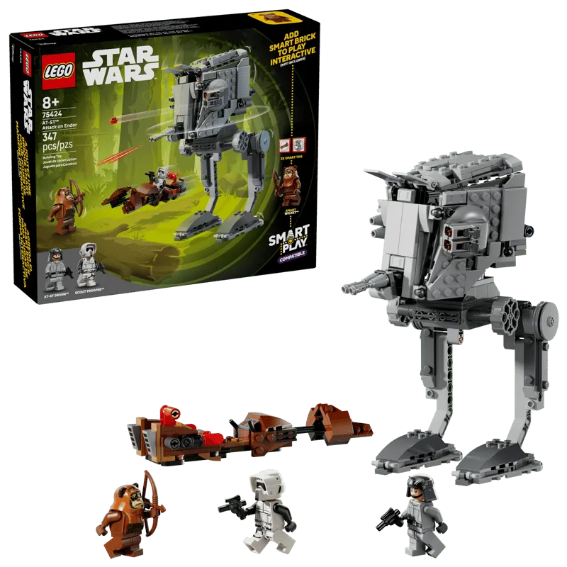 The Lego SMART Play AT-ST Attack on Endor 75424 box next to its assembled contents: an AT-ST walker, an Ewok speeder bike, an AT-ST Driver minifigure, a Scout Trooper minifigure, and Wicket the Ewok minifigure.