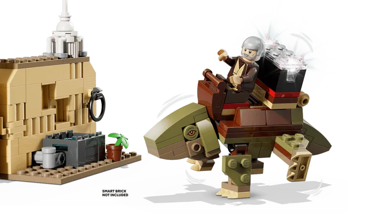 Close-up of Lego Obi-Wan Kenobi minifigure riding a green Dewback-like creature with a Stormtrooper minifigure nearby. 'SMART BRICK NOT INCLUDED' text is visible.