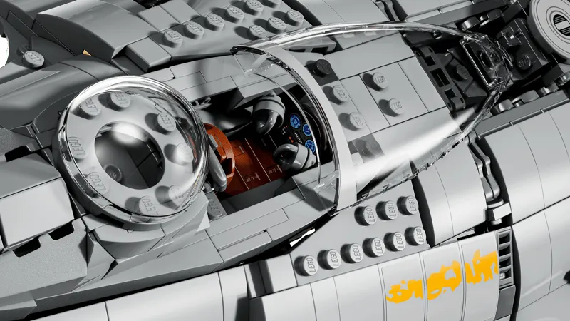Close-up of the Lego N-1 Starfighter UCS cockpit, revealing the pilot's seat, controls, and Grogu's bubble canopy behind it.