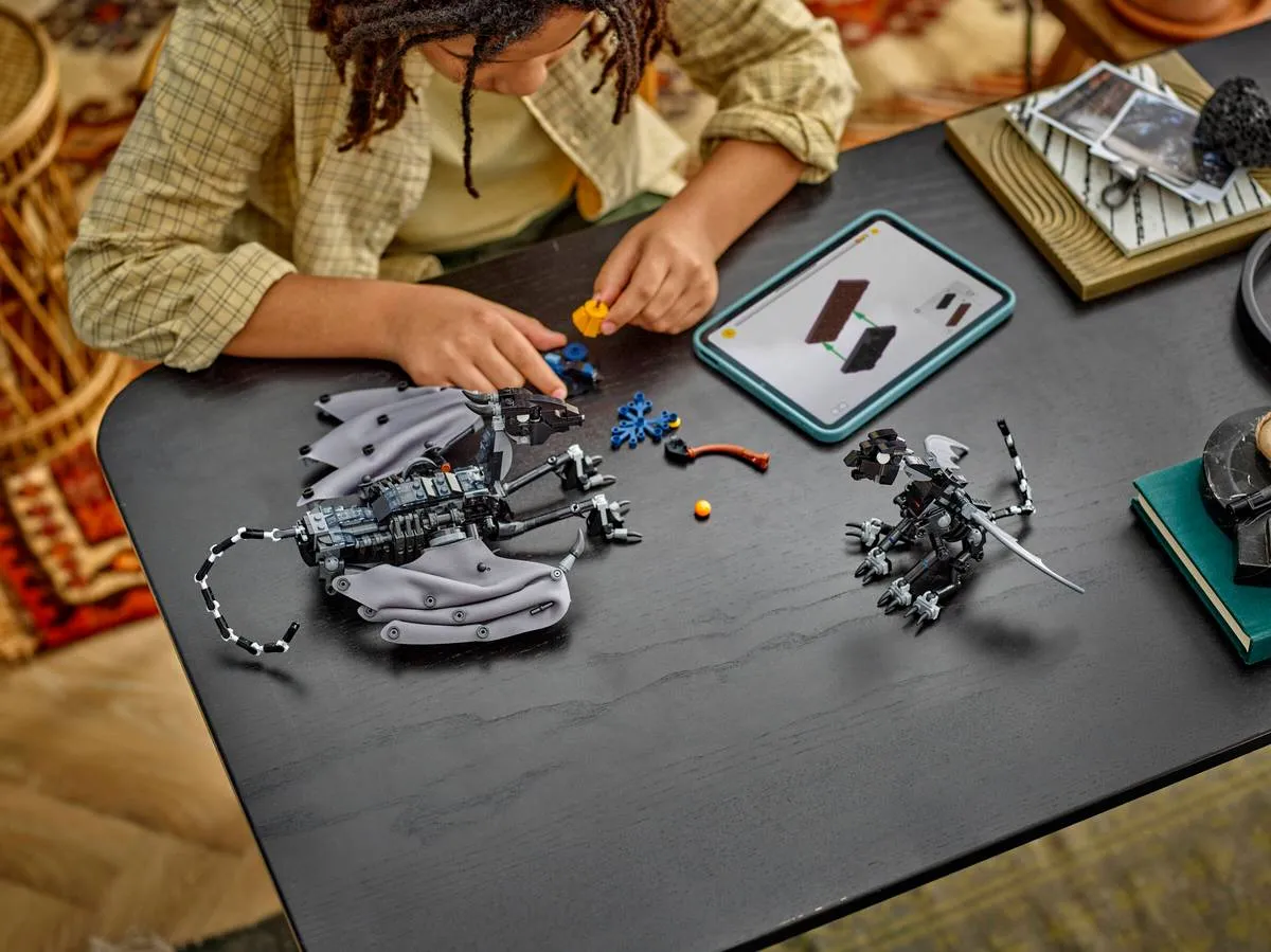 Child building Thestral with tablet.