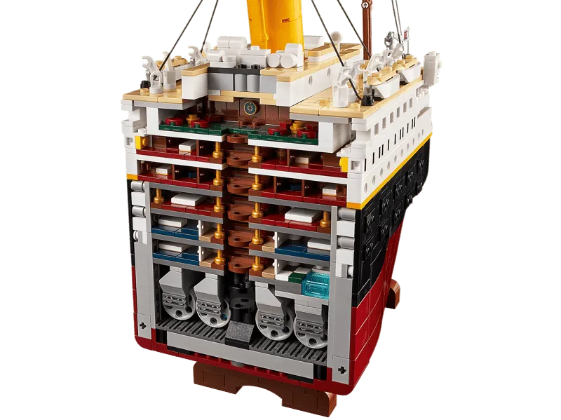 Cross-section view of the LEGO Titanic model, exposing multiple interior decks, cabins, and the lower engine room detail.