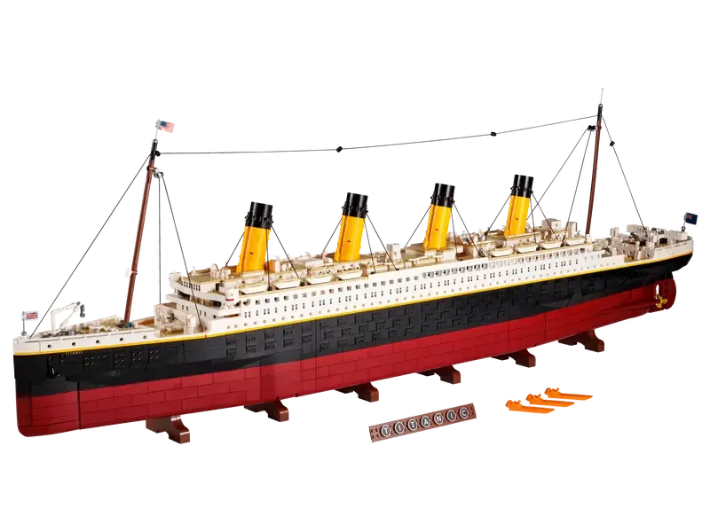 Fully assembled LEGO Titanic model from an angled top-down view, showcasing its immense length, details like lifeboats, and the display plaque.