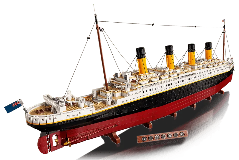 Angled top-down view of the assembled LEGO Titanic model from the stern, looking towards the bow, highlighting the entire deck layout.