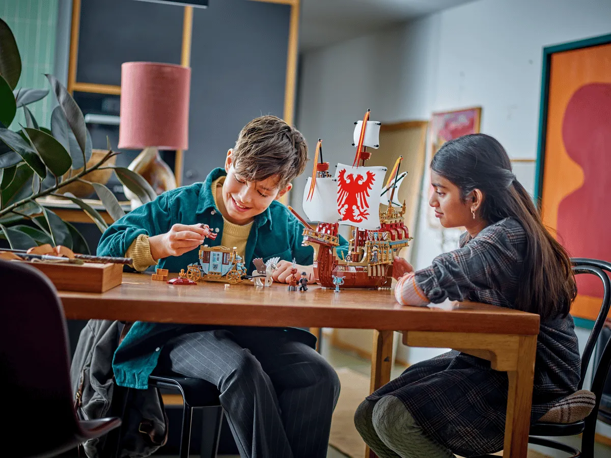 Kids playing with LEGO set.