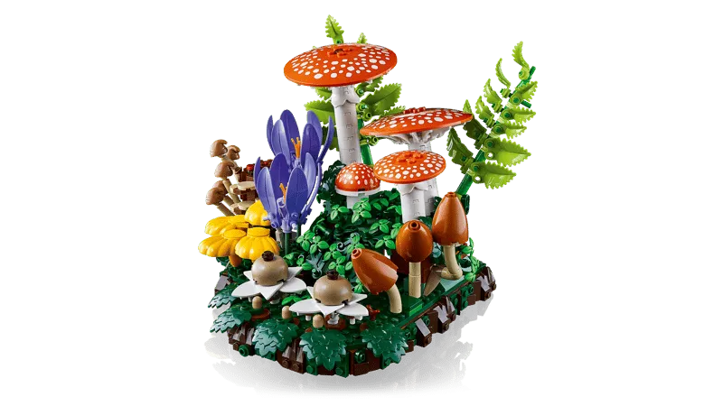 A slightly angled view of the LEGO Woodland Mushrooms 11505 set, showcasing the diverse array of fungi and plants from a different perspective, highlighting the layered construction on its base.