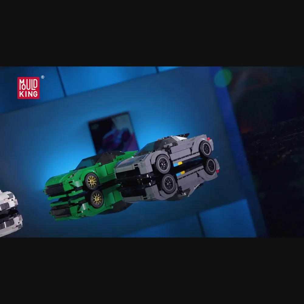 Two brick cars on reflective surface.