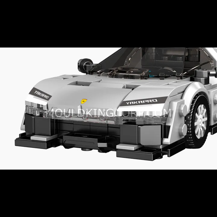 Close-up front view of the Mould King KC23 Supercar block model, emphasizing the aggressive front grille, detailed headlights, and a subtle 'YAKAPRO' branding on the hood.